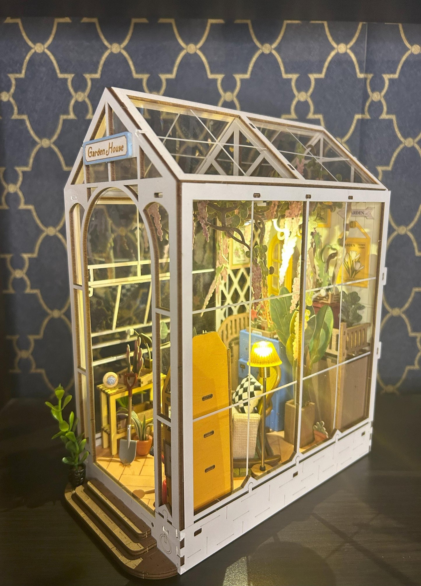 Assembled and Embellished Garden Greenhouse Book Nook