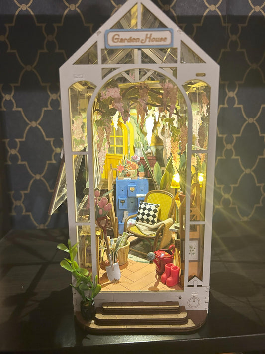 Assembled and Embellished Garden Greenhouse Book Nook