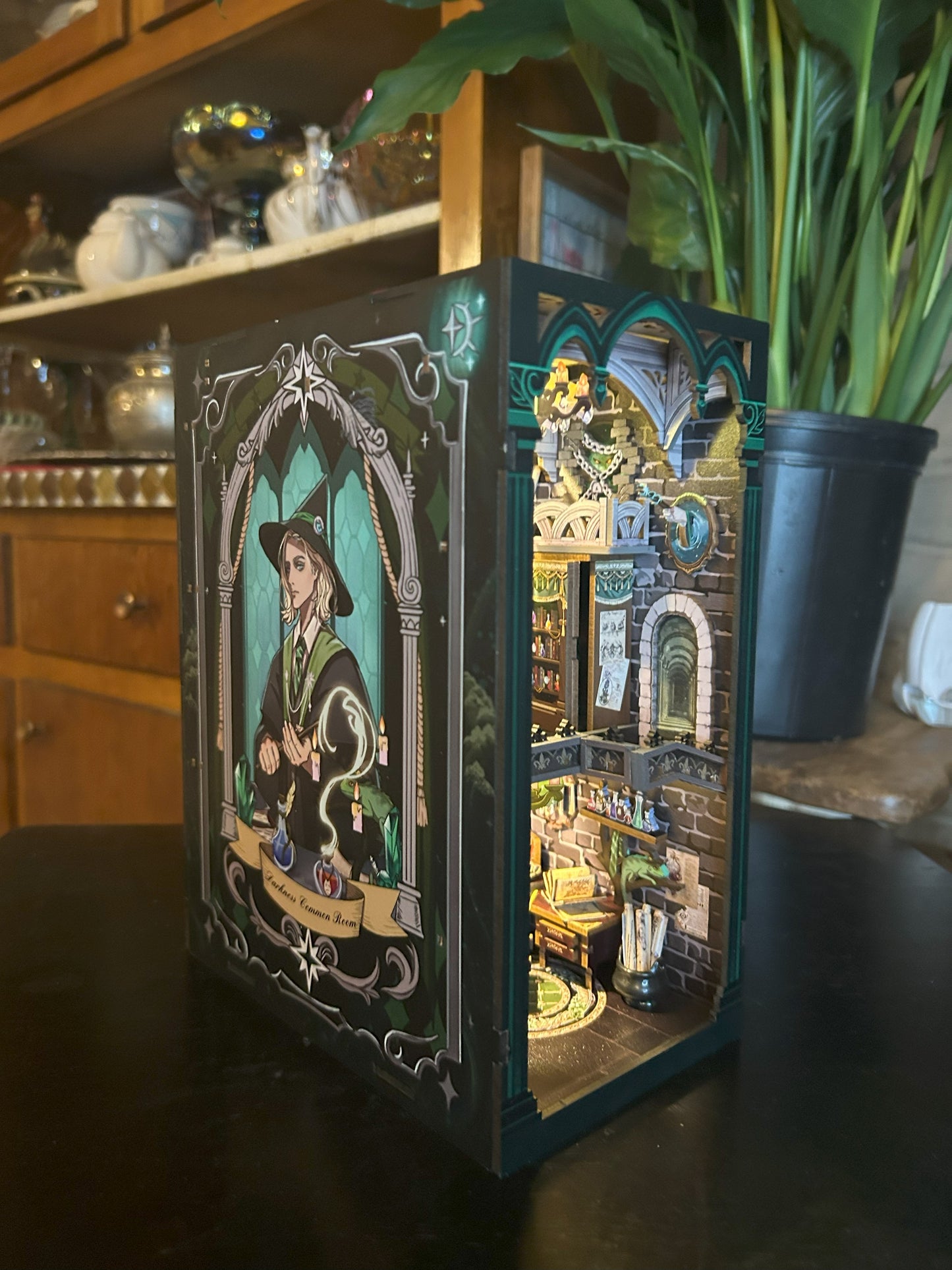 Wizard Inspired book nook called "Darkness Common Room"