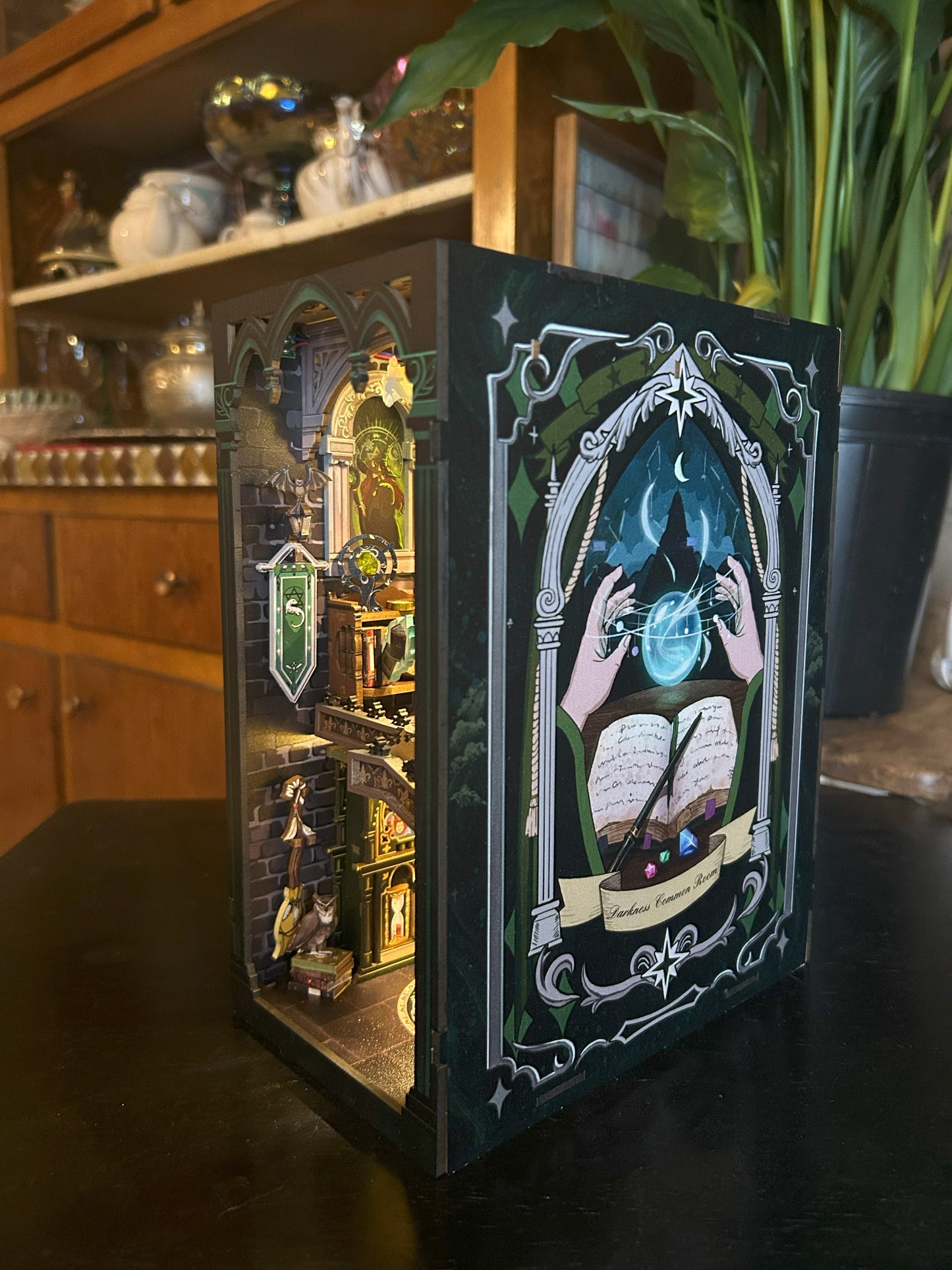 Wizard Inspired book nook called "Darkness Common Room"